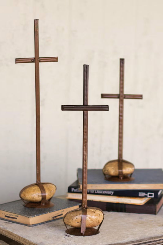 Set of three scrap metal crosses with caged rock bases by Kalalou